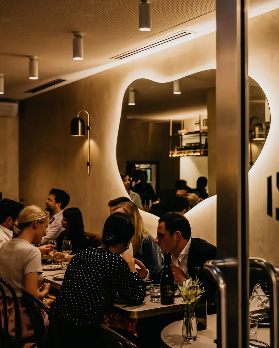 Cozy interior of Ragazzi Wine & Pasta in Sydney, with diners enjoying the evening