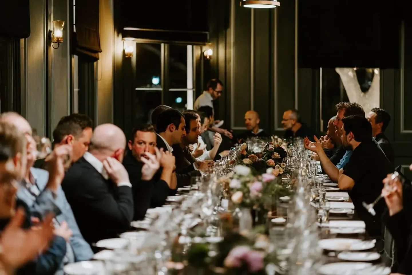 Dining experience at Railway Club Hotel in Melbourne, with tables of people
