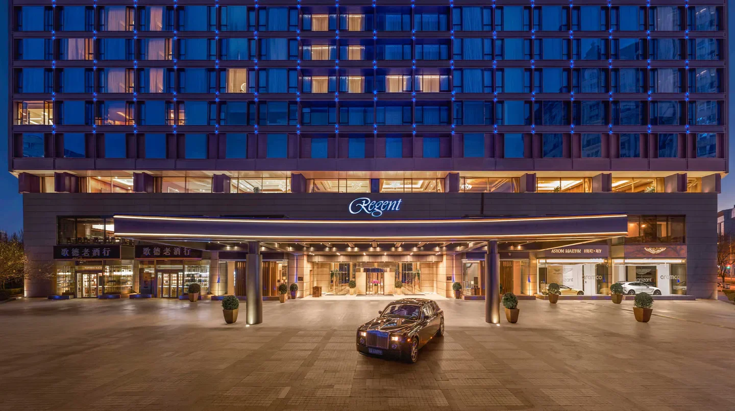 Entrance of Regent Beijing hotel in Beijing with luxury car parked at the front