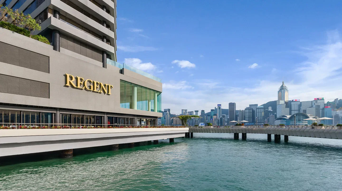 Exterior view of Regent Hong Kong hotel in Hong Kong with harbor and city skyline