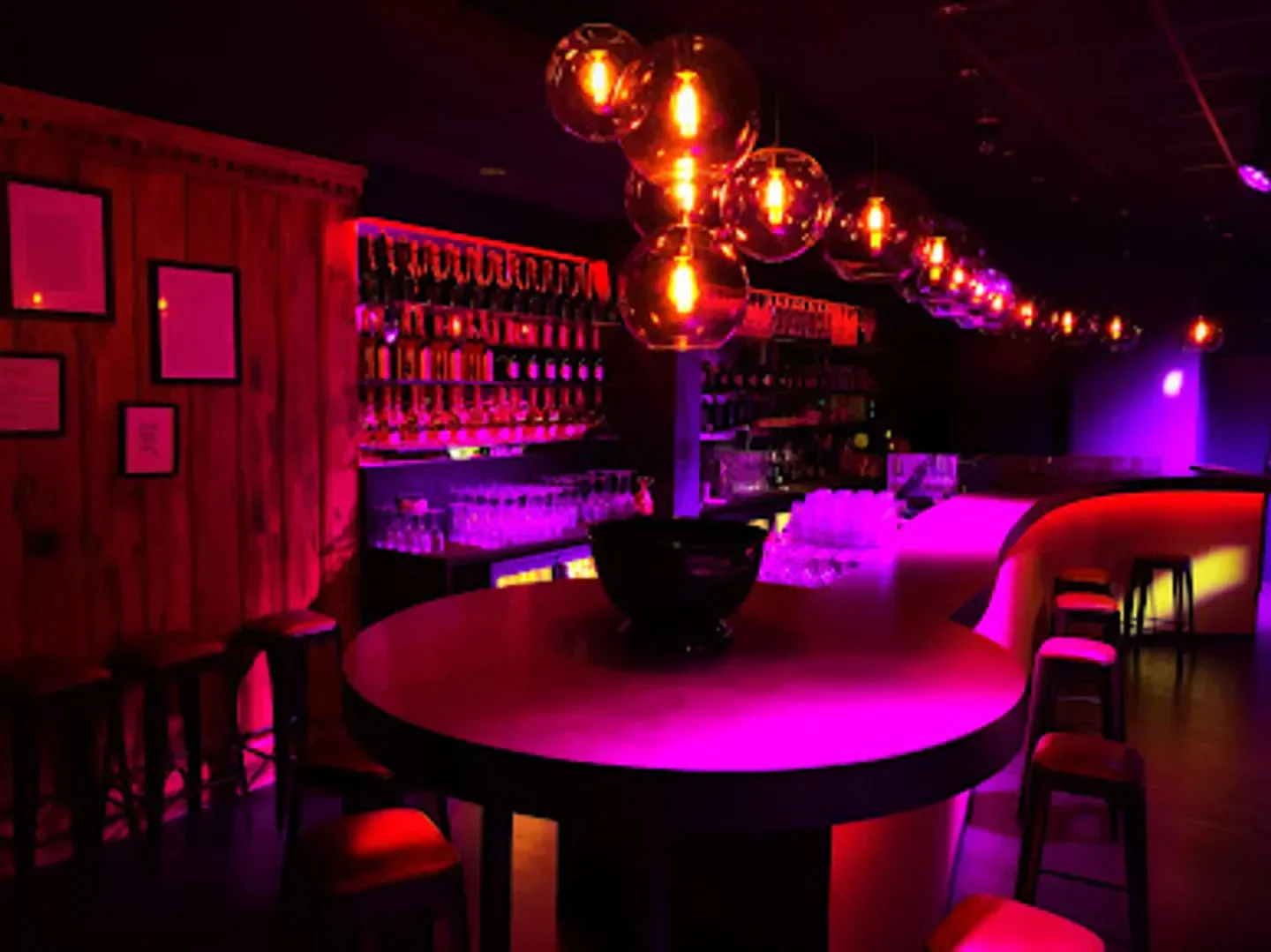 Interior of Rendez-vous Club in Megeve with neon lights and bar