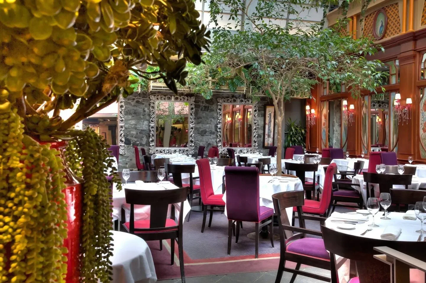 Interior of Restaurant Le Saint Amour in Quebec City with elegant decor and dining tables