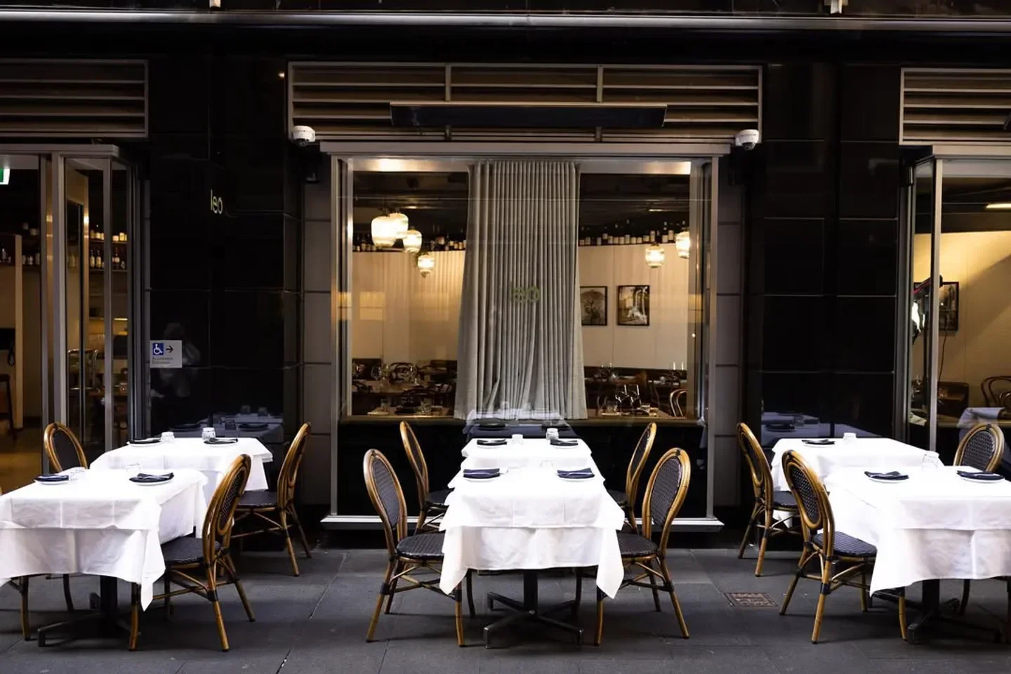 Outdoor seating at Restaurant Leo in Sydney, with elegant tables and chairs ready for dining.