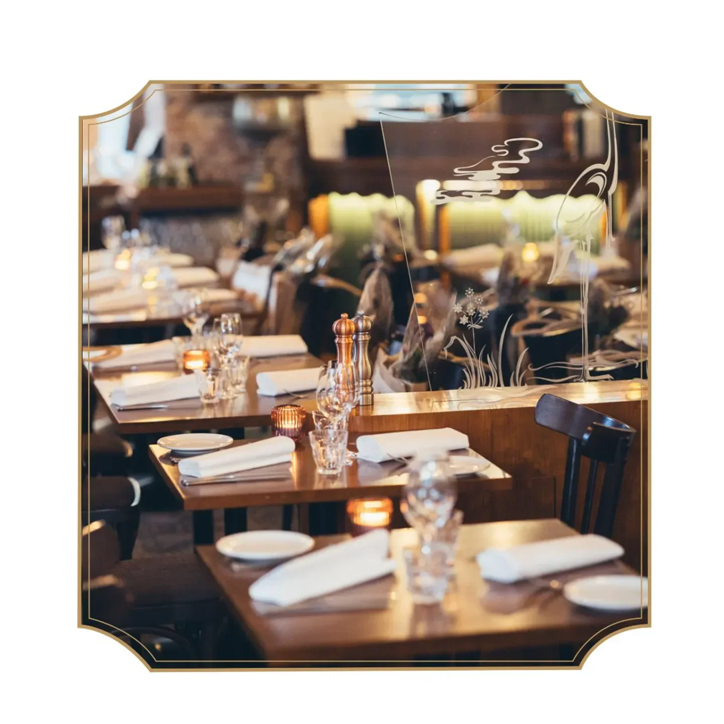Elegant dining tables at Restaurant Pastis in Helsinki, featuring artful glass details.