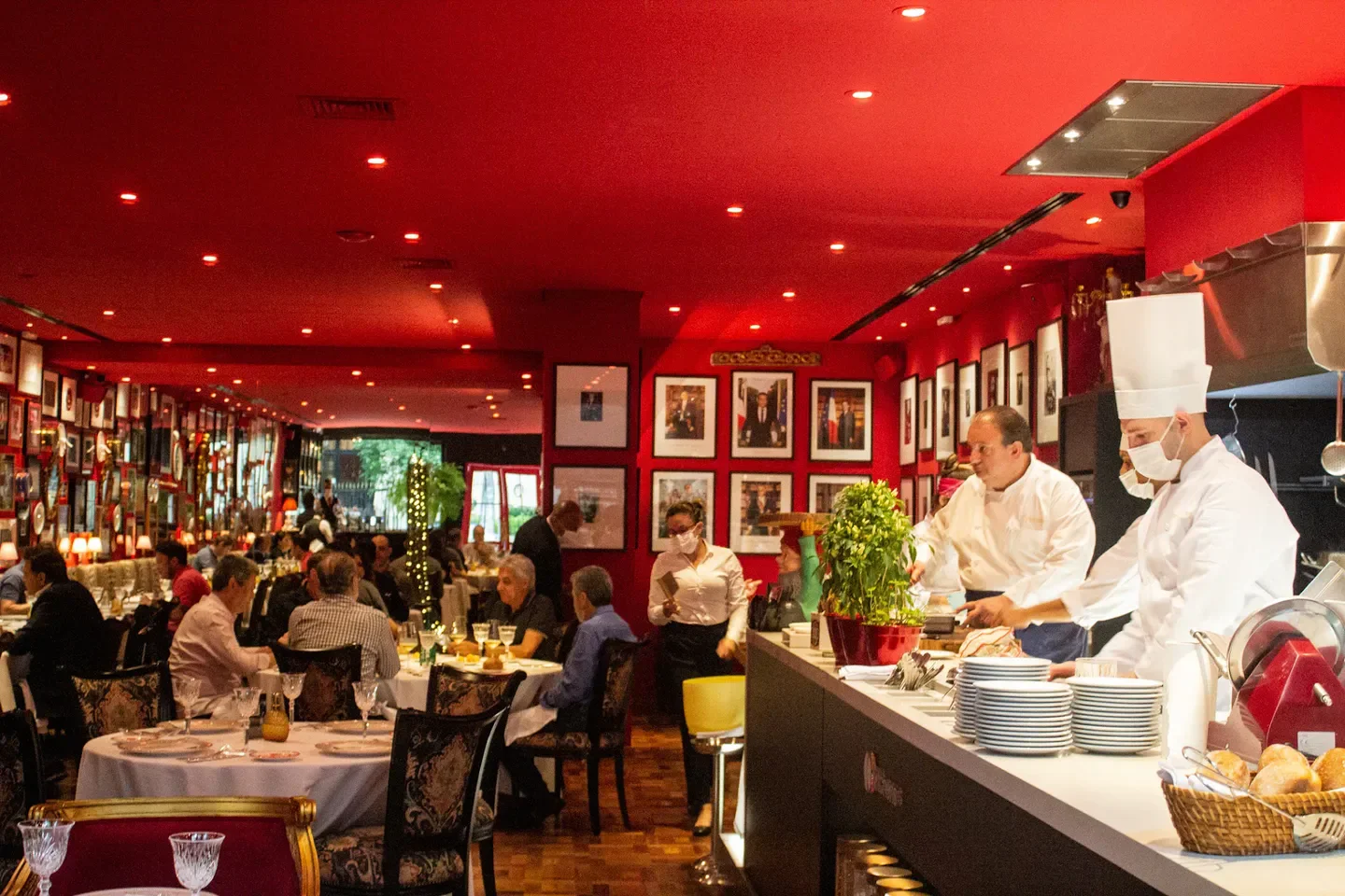 Interior of Restaurante Président in Sao Paulo, chefs at work and patrons dining.