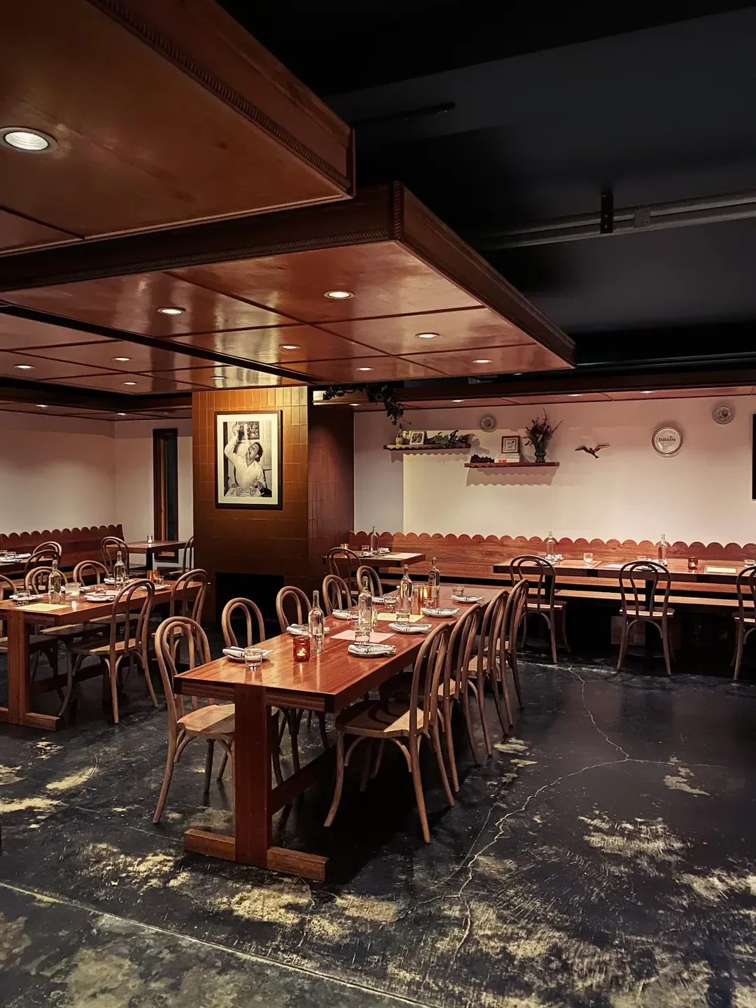 Interior dining at Ripe Cooperative in Portland. Wood tables, chairs, and elegant lighting.