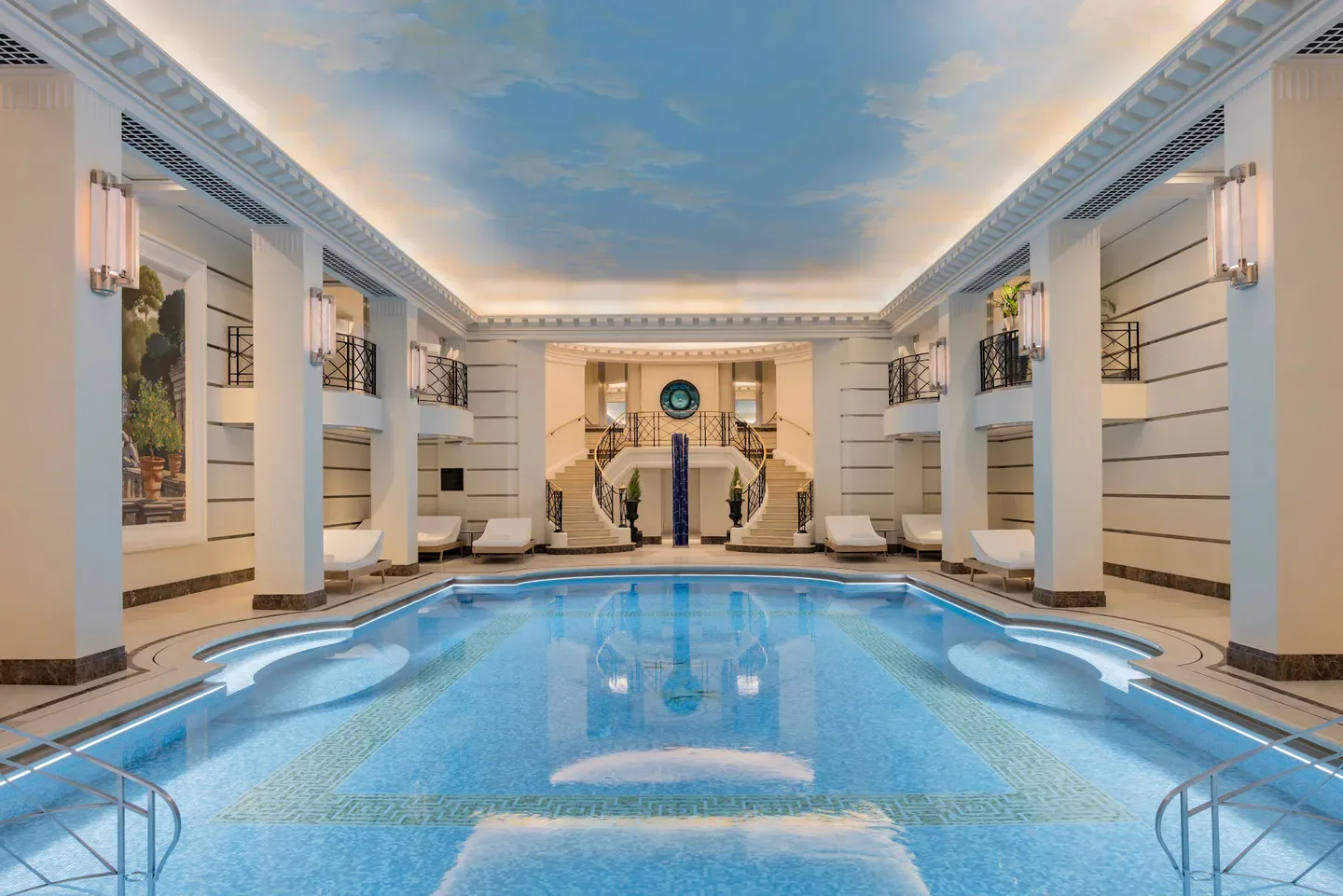 Indoor pool at Ritz Club & Spa in Paris, luxurious spa with a painted sky ceiling