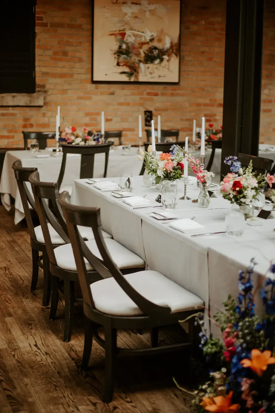 Elegant dining at Riverhorse on Main in Park City, with floral centerpieces and candles.