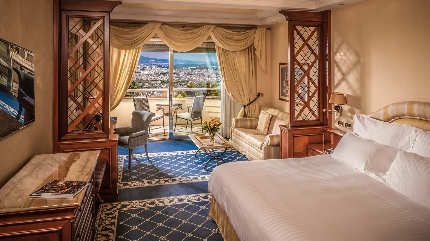 Luxury hotel room with city views at Rome Cavalieri, A Waldorf Astoria Hotel in Rome.