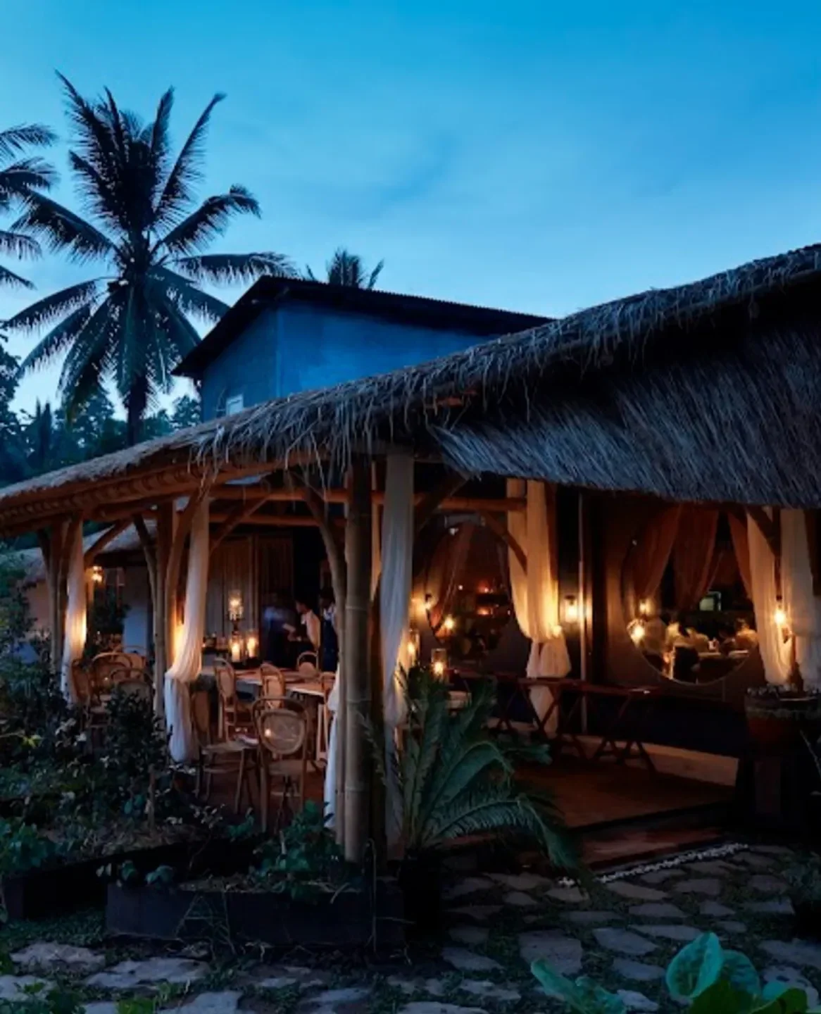 Room 4 Dessert in Bali: cozy, tropical dining space with warm lighting and palm trees.