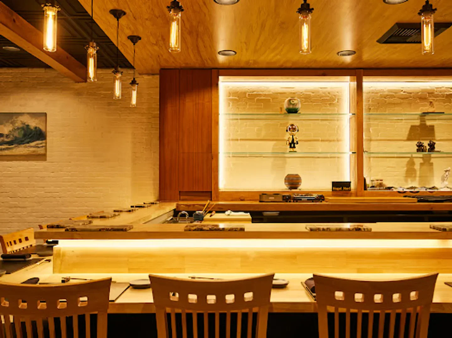 Interior of R|O-Rebel Omakase restaurant in Orange County, featuring sushi bar seating and decor.