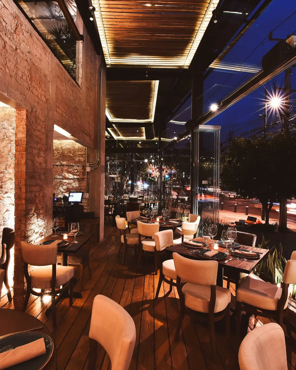 Interior dining at Rosa Negra - Polanco restaurant in Mexico City at night.
