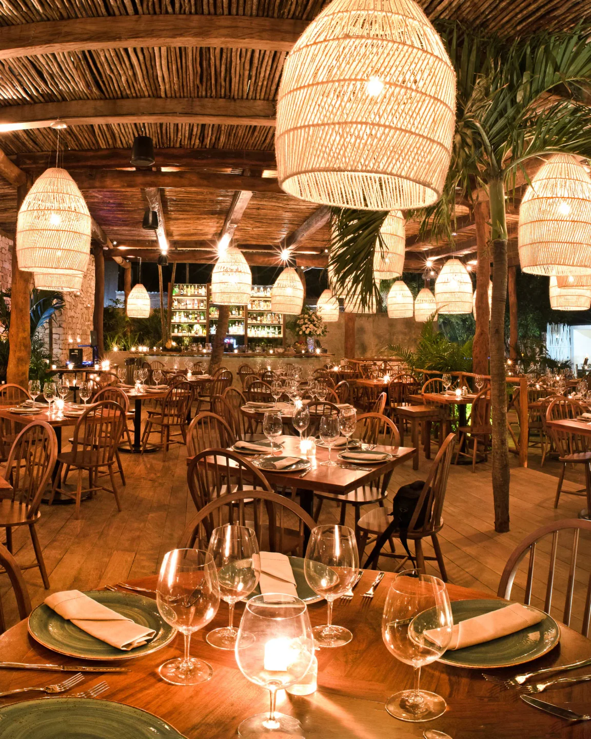Elegant interior of Rosa Negra nightclub in Tulum, Mexico, featuring unique lighting and a warm, inviting atmosphere.