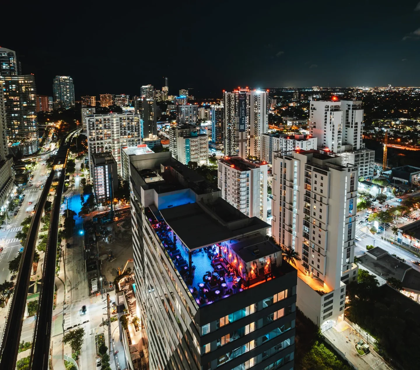 Rosa Sky Miami rooftop nightlife with vibrant city lights and skyscrapers at night
