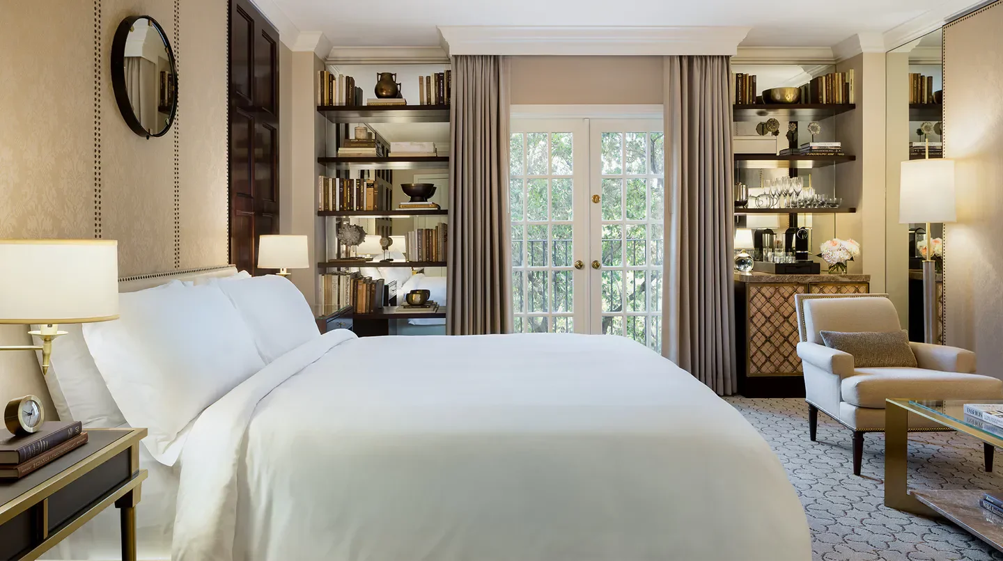 Cozy bedroom at the Rosewood Mansion on Turtle Creek in Dallas with elegant decor