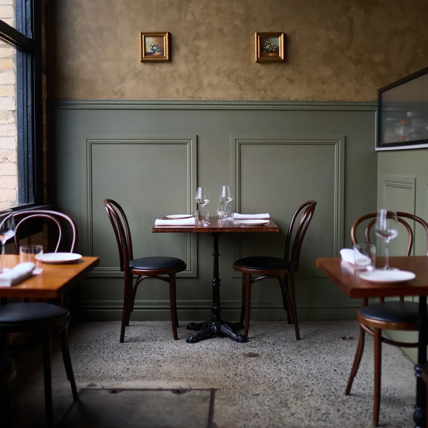 Elegant dining interior at Rosmarino Ristorante & Wine Bar in Brisbane with tables set.