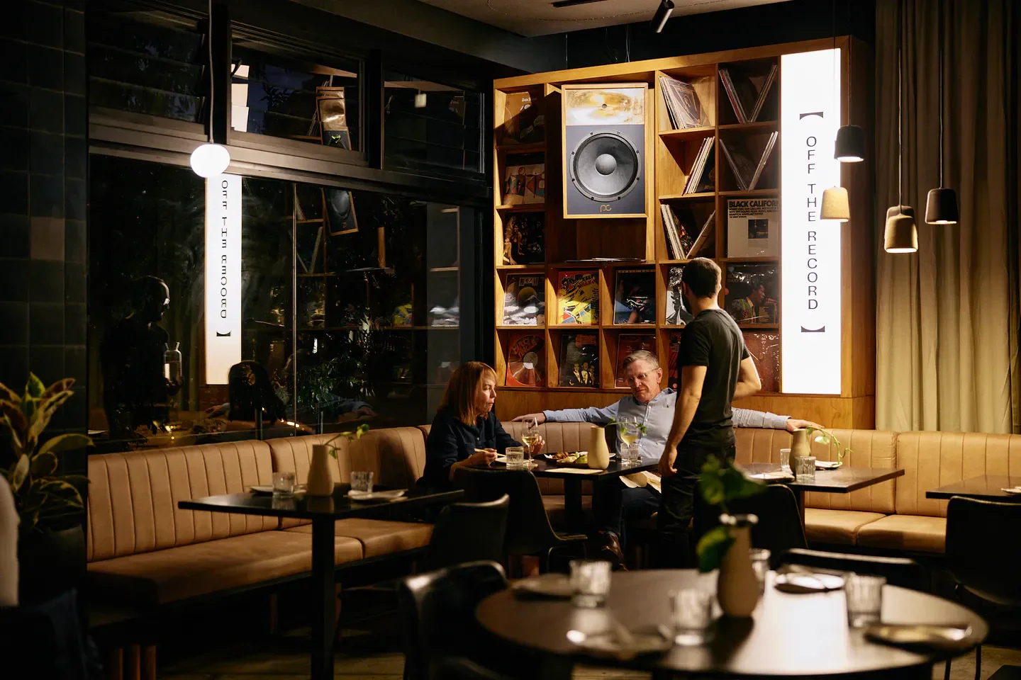 Interior of Ruby, My Dear restaurant in Brisbane, featuring vinyl records and dining.