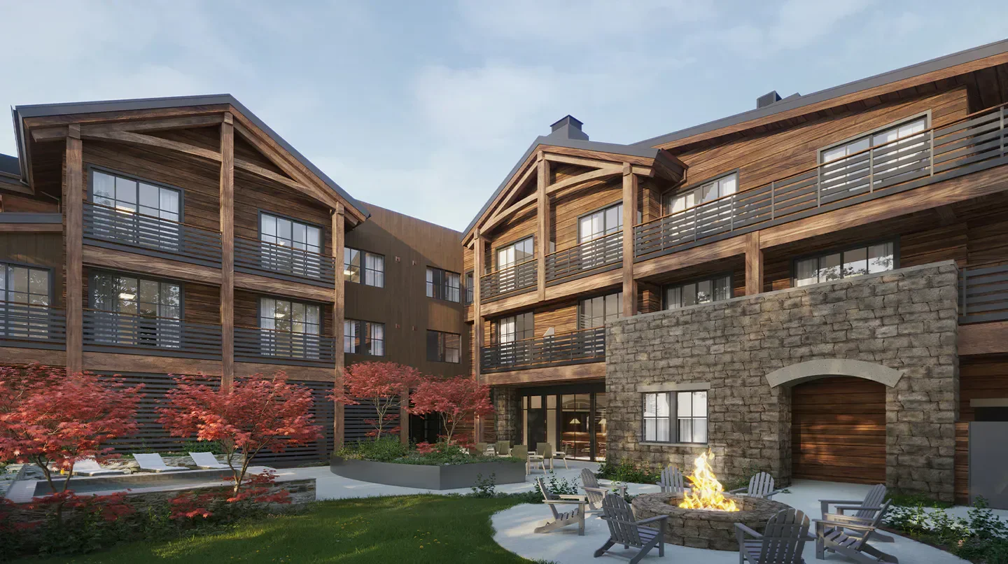 Exterior of Rusty Parrot Lodge & Spa in Jacksonville with a cozy fire pit.