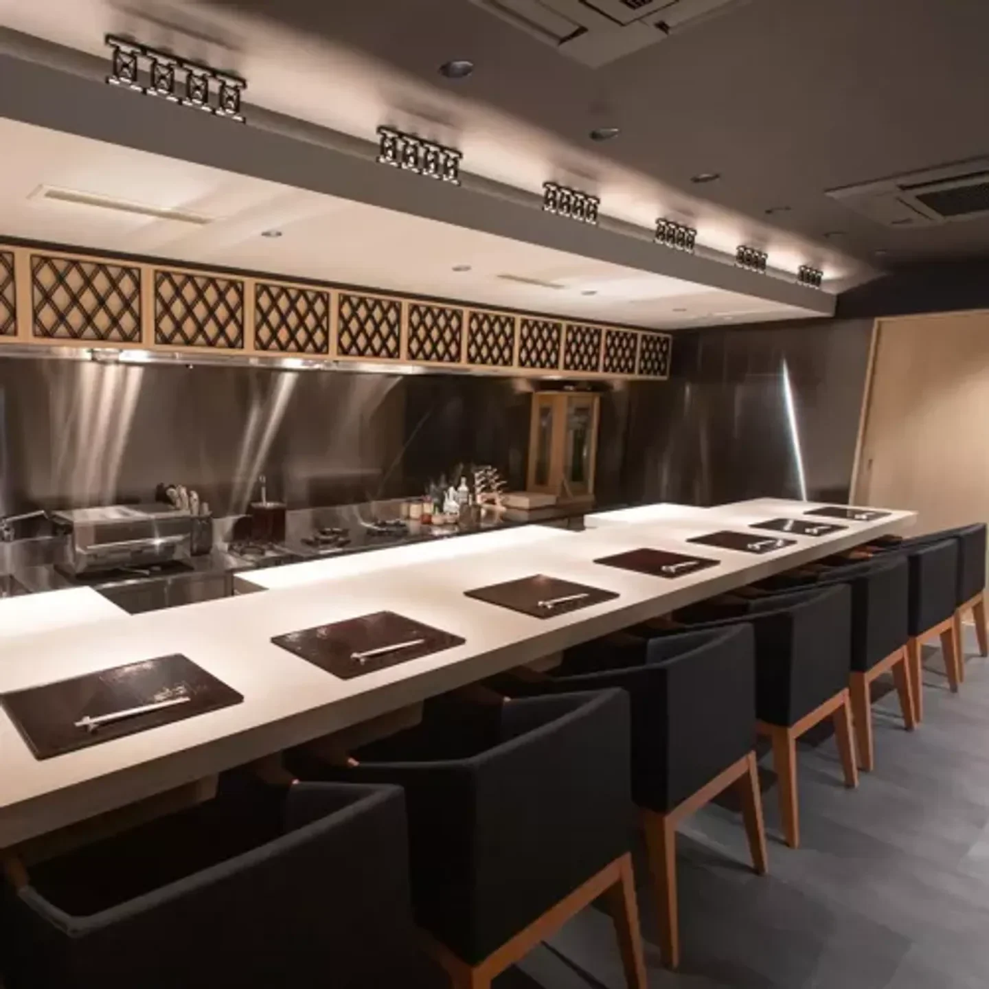 Elegant dining space at Ryoriya Inaya restaurant in Osaka, showcasing modern design.