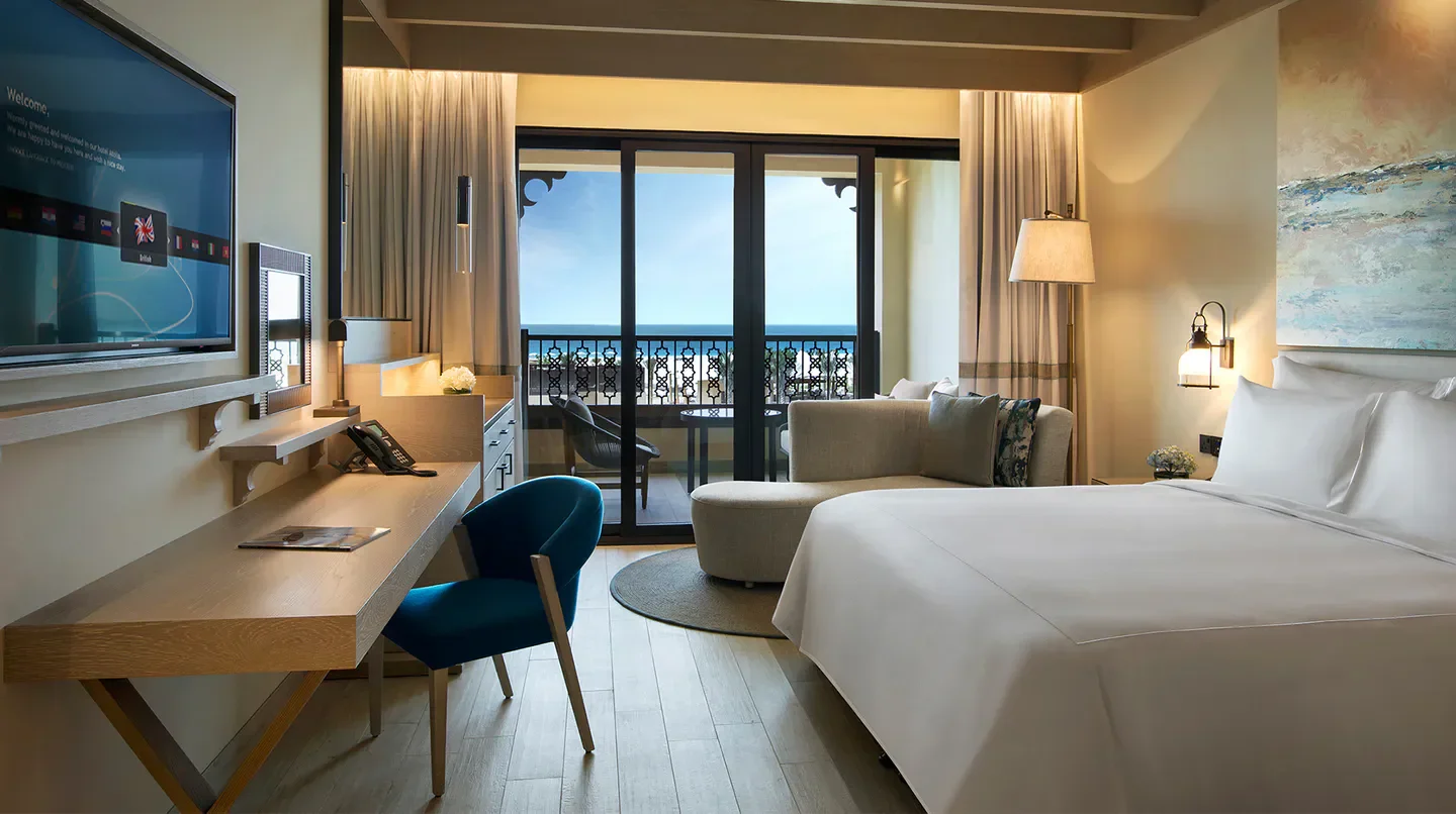 Luxury hotel room at Saadiyat Rotana Resort & Villas in Abu Dhabi with ocean view.