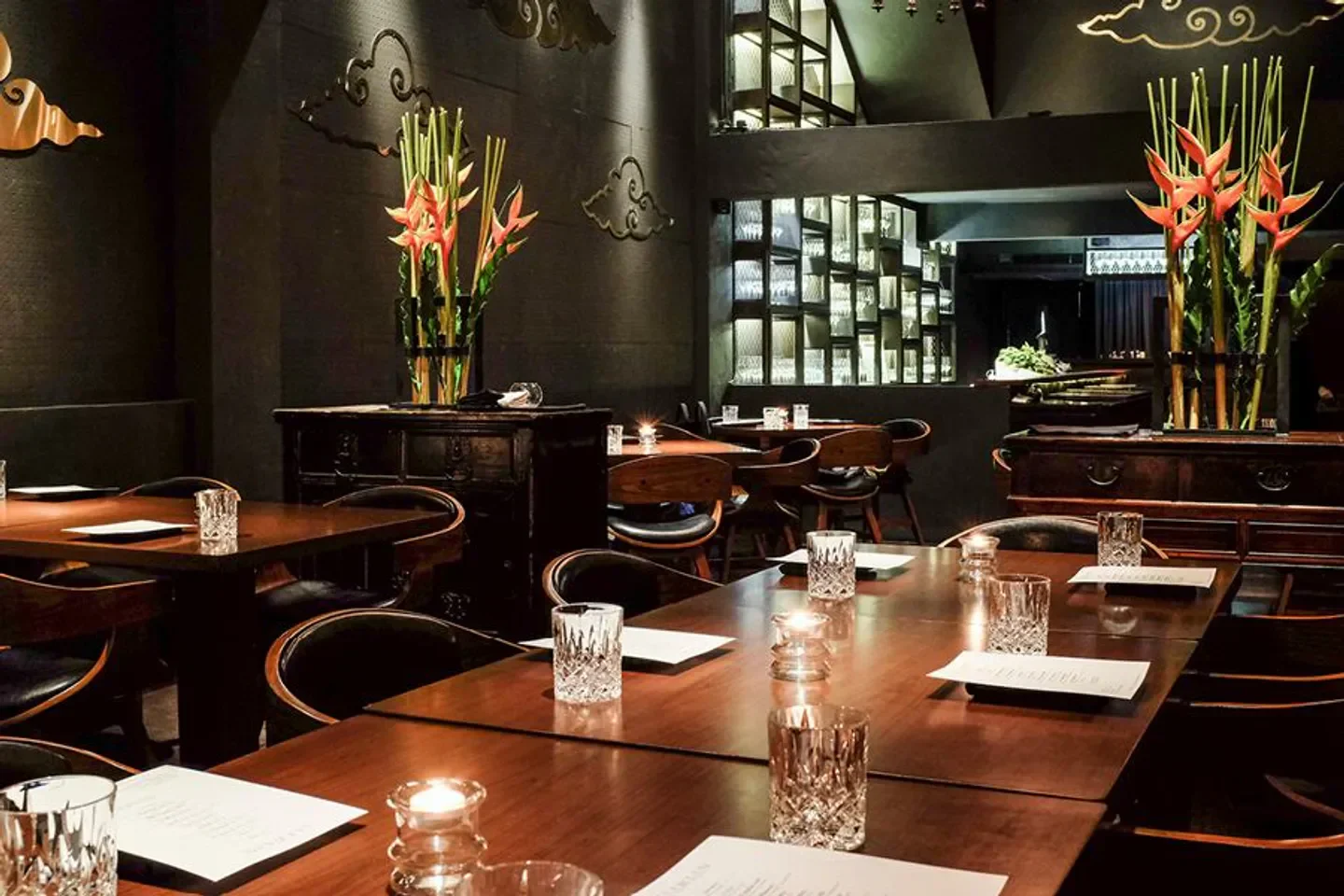 Elegant interior of Saawaan restaurant in Bangkok, featuring candlelit tables and decor.