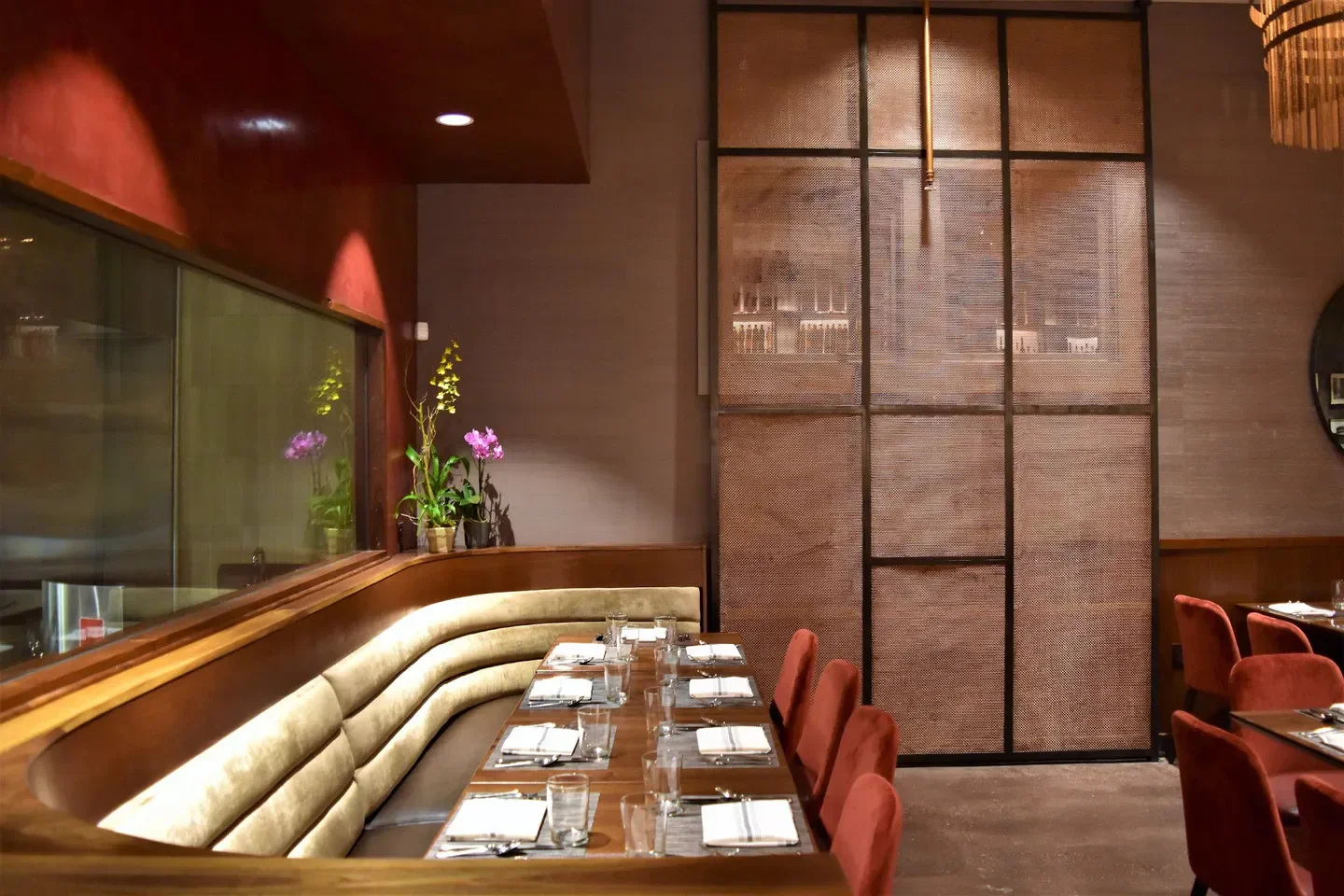 Elegant dining area at SAFFRON NOLA restaurant in New Orleans with stylish decor.