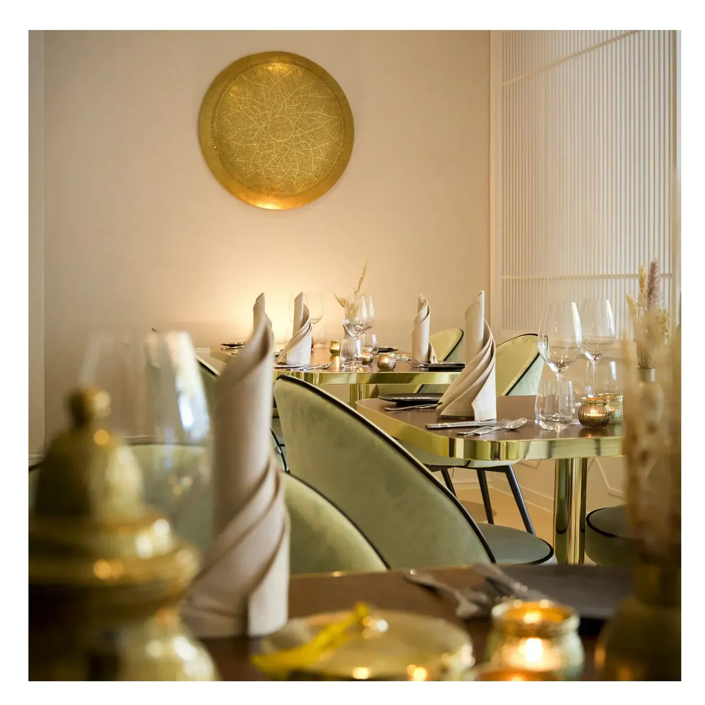 Elegant interior of Sahila - The Restaurant in Cologne with stylish table settings.