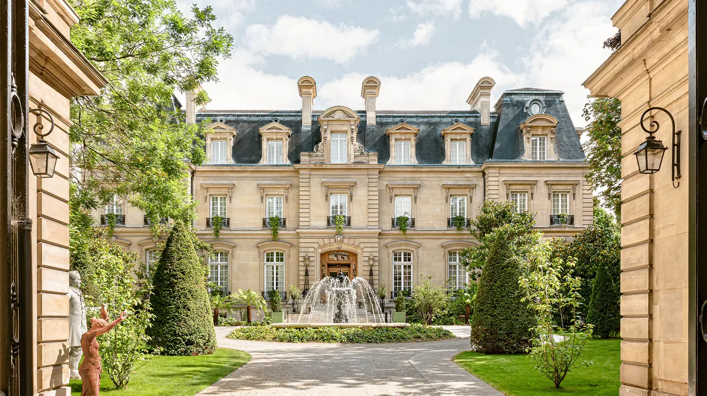 Exterior of Saint James Paris hotel in Paris with fountain and classic architecture