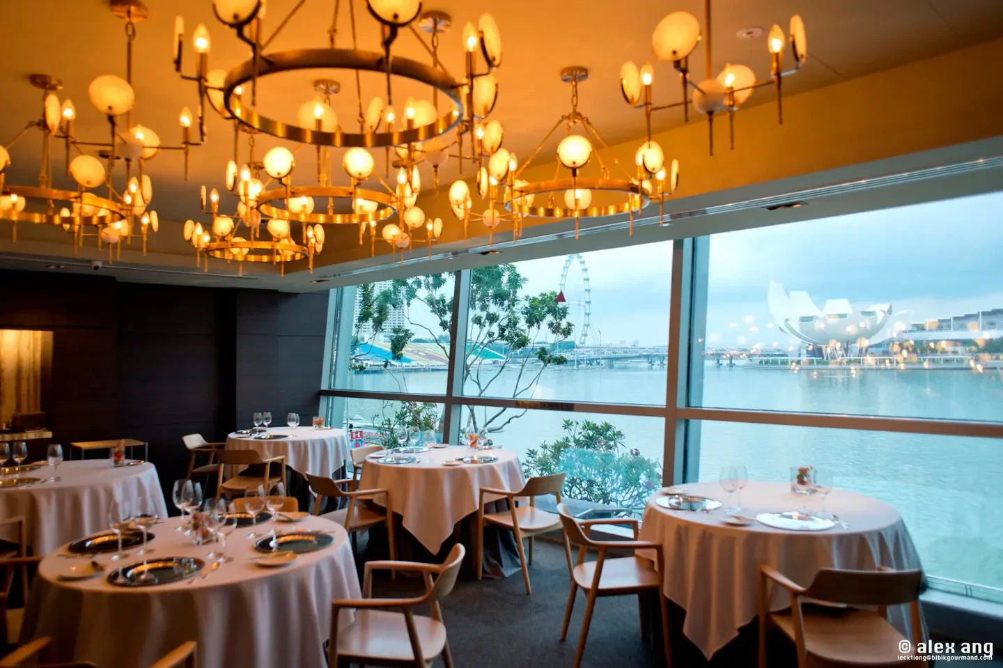 Elegant dining room at Saint Pierre restaurant in Singapore, with scenic city views