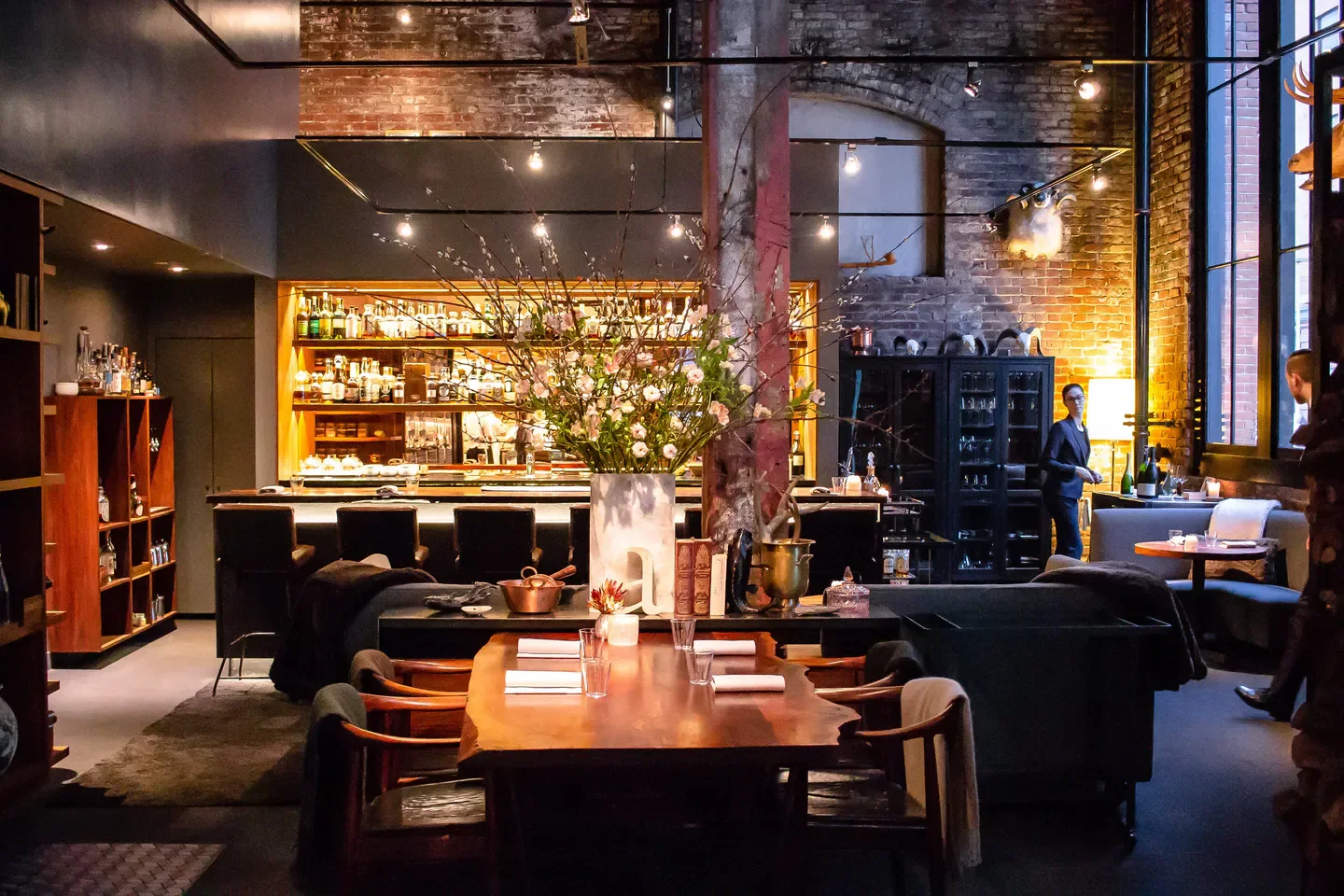 Interior of Saison restaurant in San Francisco, with a cozy dining area and bar.
