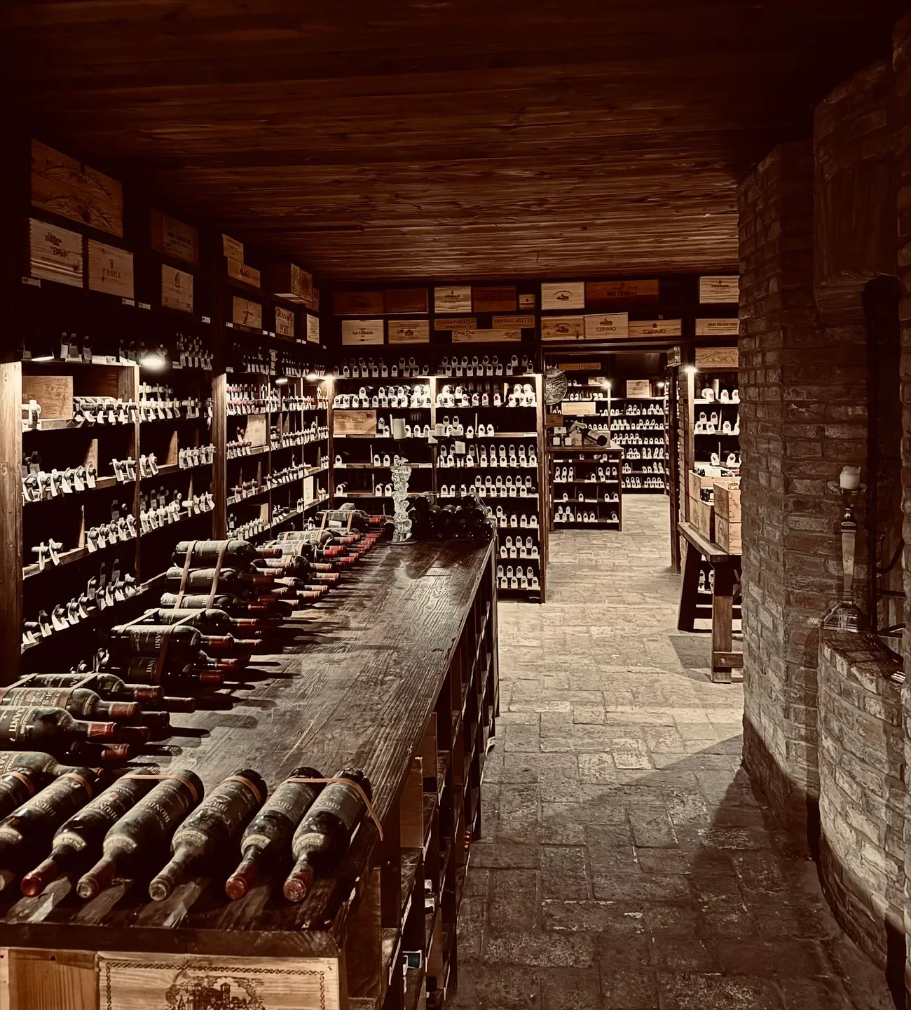 Wine cellar at San Domenico restaurant in Emilia-Romagna, Italy, showcasing fine wines.