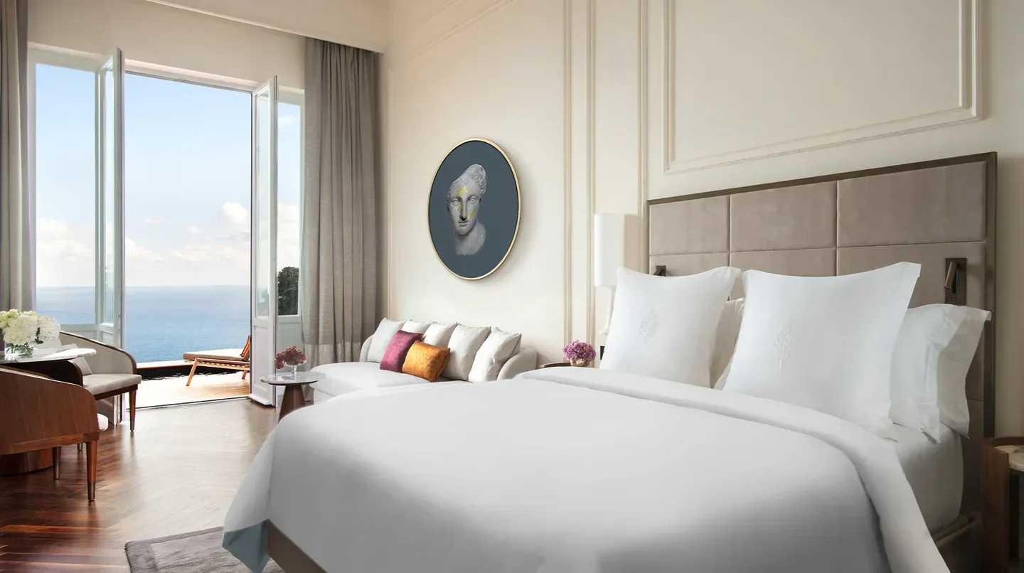 Elegant bedroom at San Domenico Palace, Taormina, a Four Seasons Hotel with sea views in Taormina.