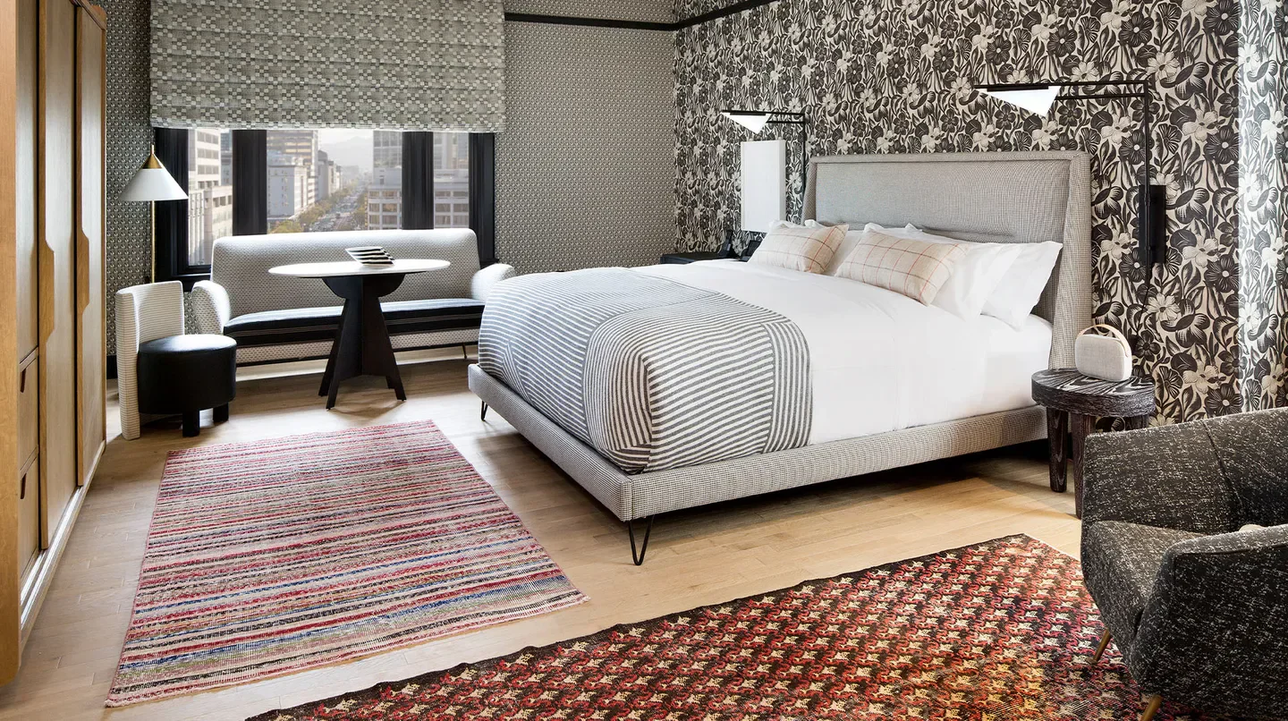 Stylish hotel bedroom at the San Francisco Proper Hotel in San Francisco, California.