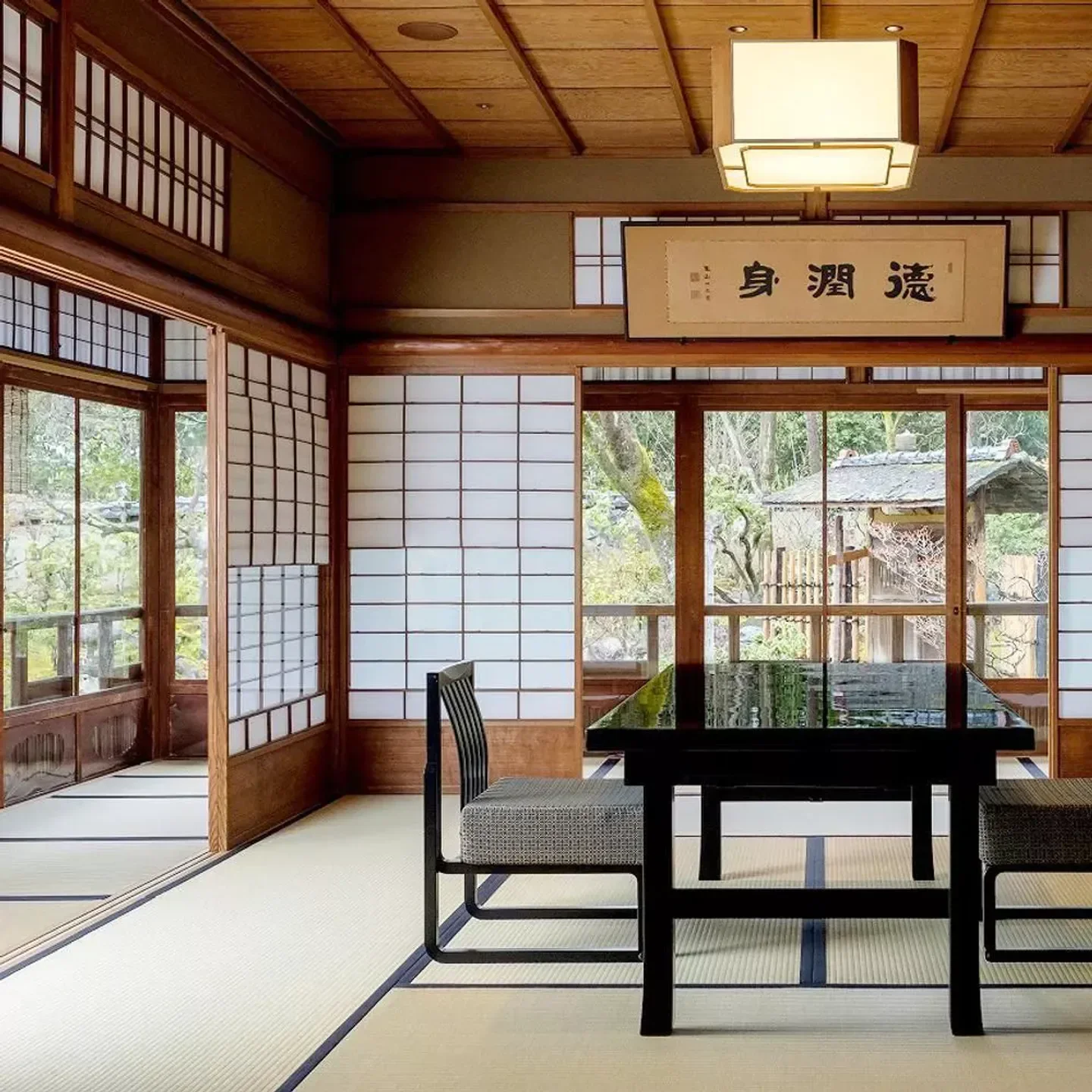 Interior of Sanso Kyoyamato restaurant in Kyoto, featuring traditional Japanese design.