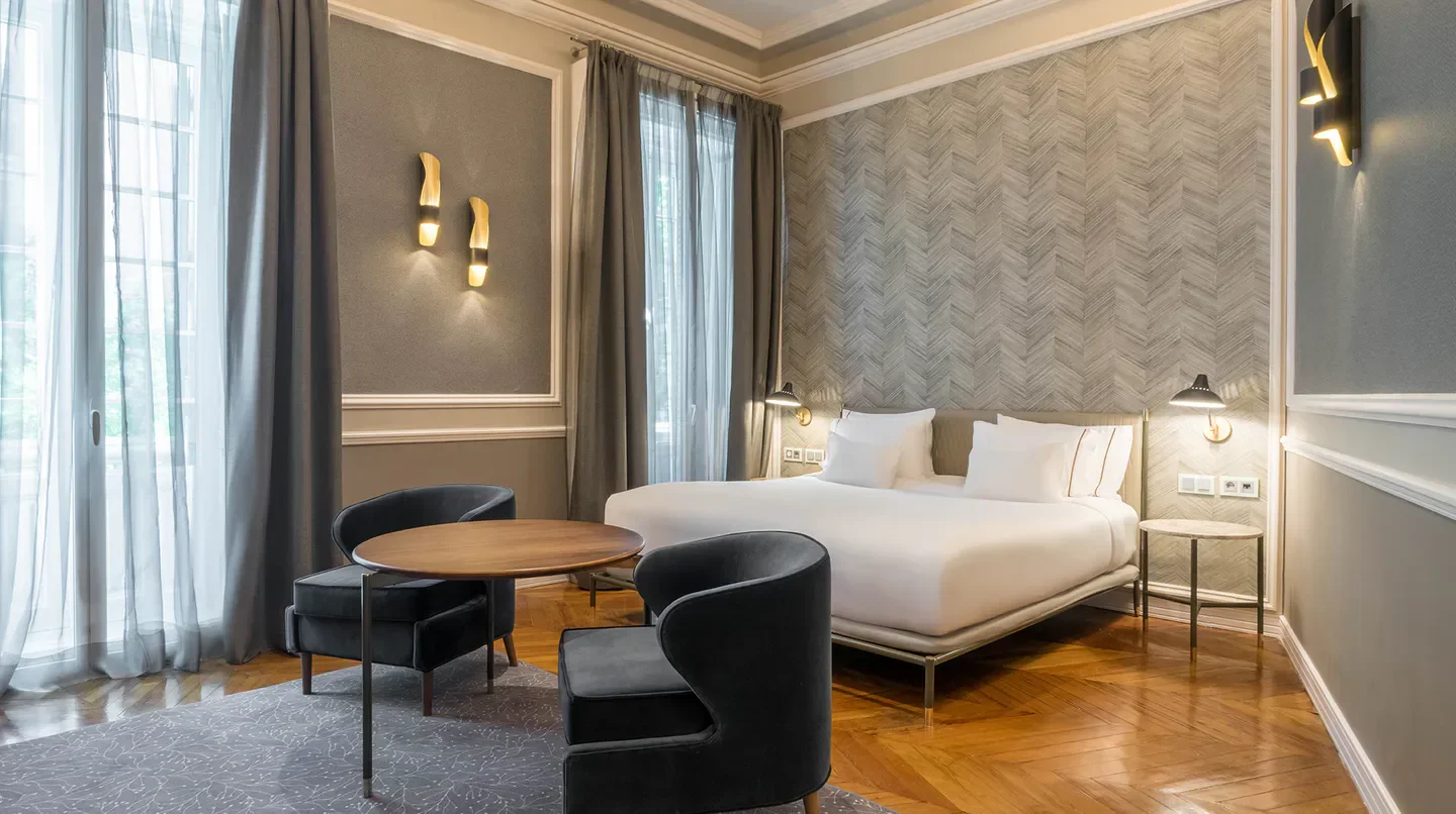 Elegant bedroom at Santo Mauro, A Luxury Collection Hotel, Madrid, with stylish decor.