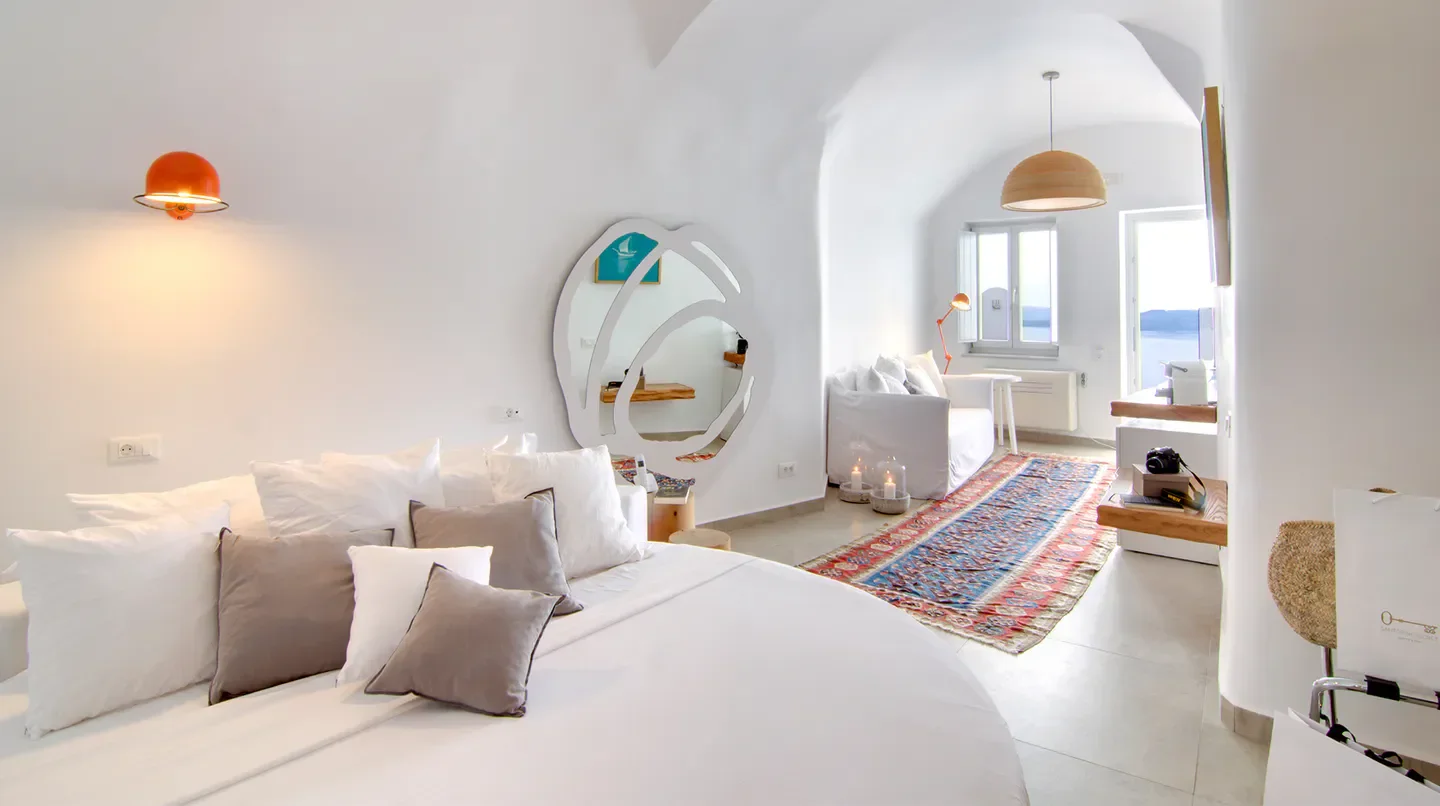 Cozy bedroom at Santorini Secret Suites & Spa in Santorini with sea view