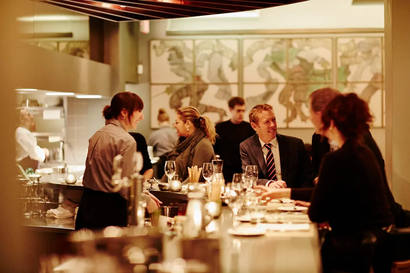 Dining experience at Scaramouche in Toronto, with guests enjoying the restaurant's ambiance.