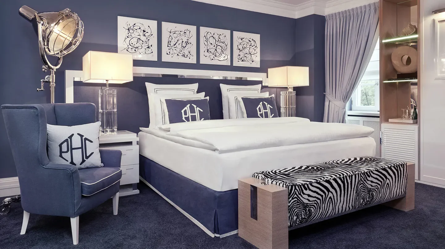 Elegant bedroom at Schlosshotel Berlin by Patrick Hellmann in Berlin, featuring stylish decor.