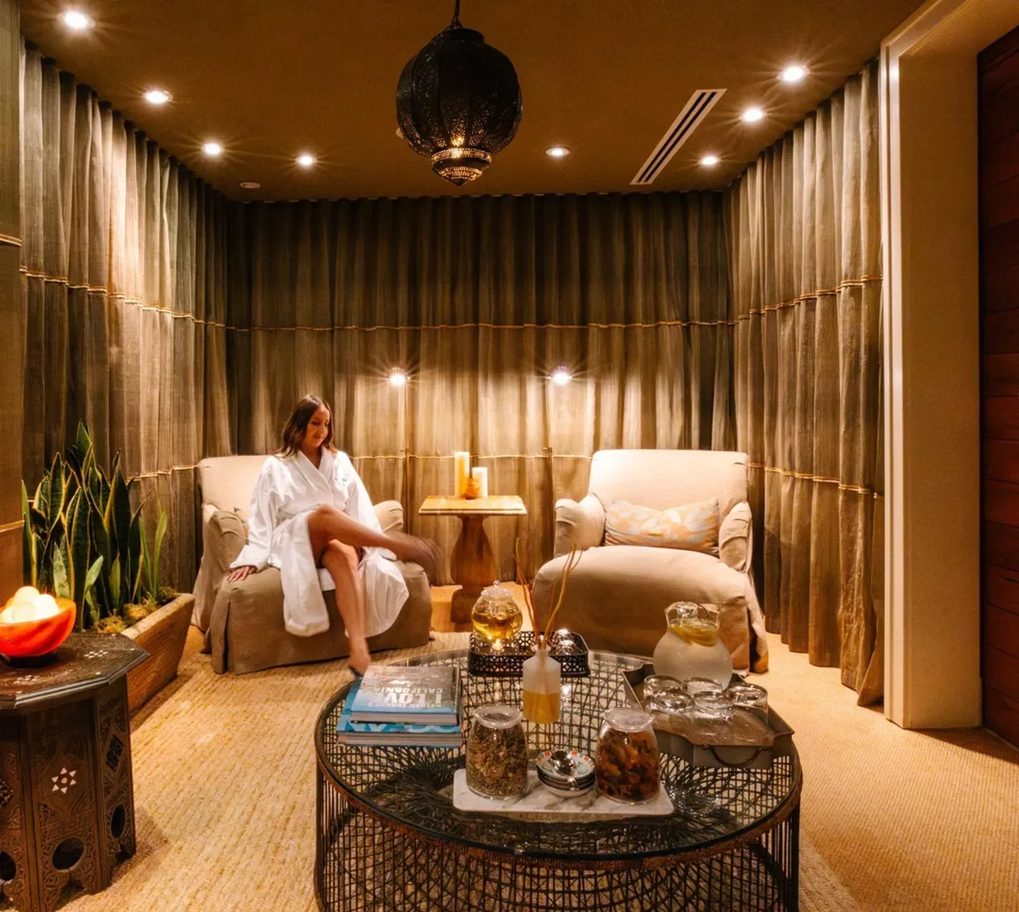 Sea Wellness Spa in Los Angeles: woman relaxing in spa lounge.