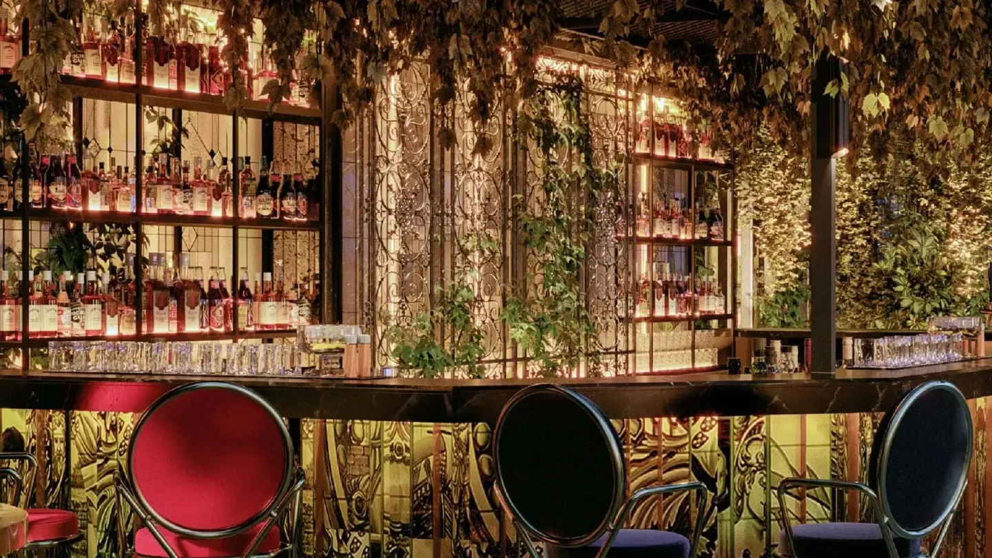 Interior bar at SEEN in Rome, featuring stylish seating and unique decor.
