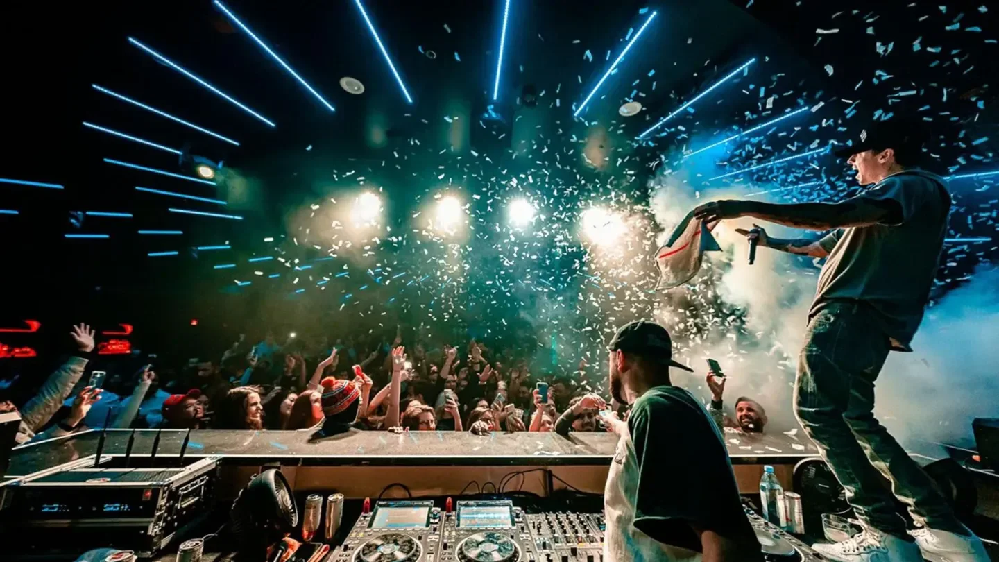 Energetic crowd at Sekai Nightclub in Houston, with confetti during a performance