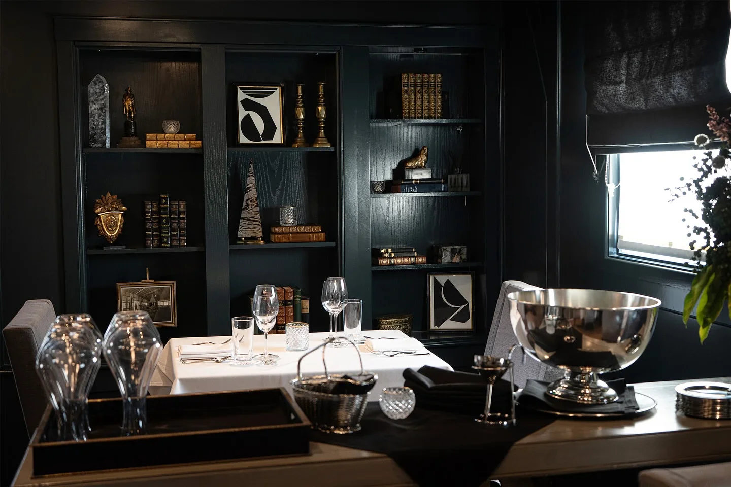 Elegant interior of Selanne Steak Tavern in Orange County with stylish decor and a prepared table for fine dining.