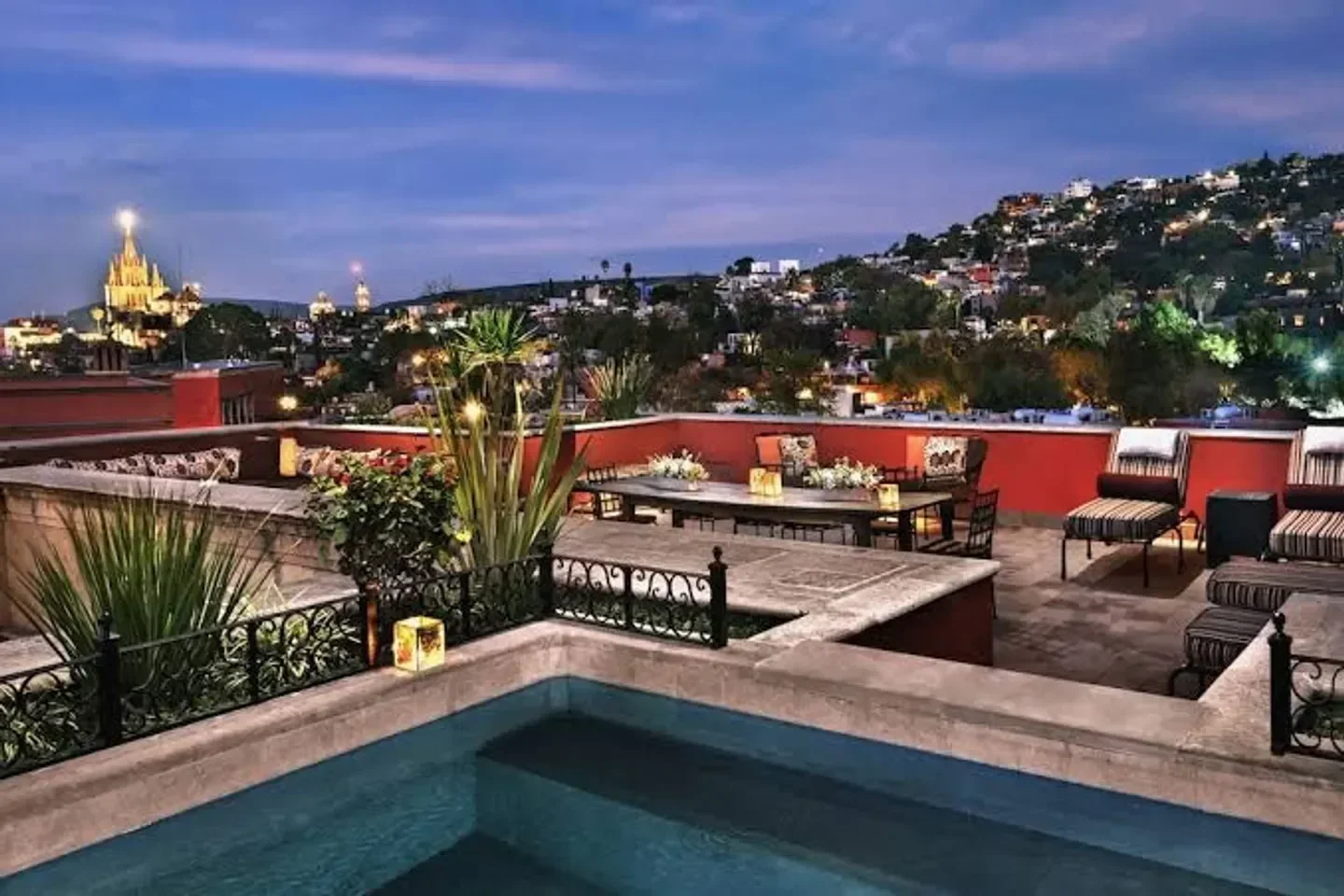 Rooftop pool at Sense, A Rosewood Spa at San Miguel de Allende, at dusk with city views