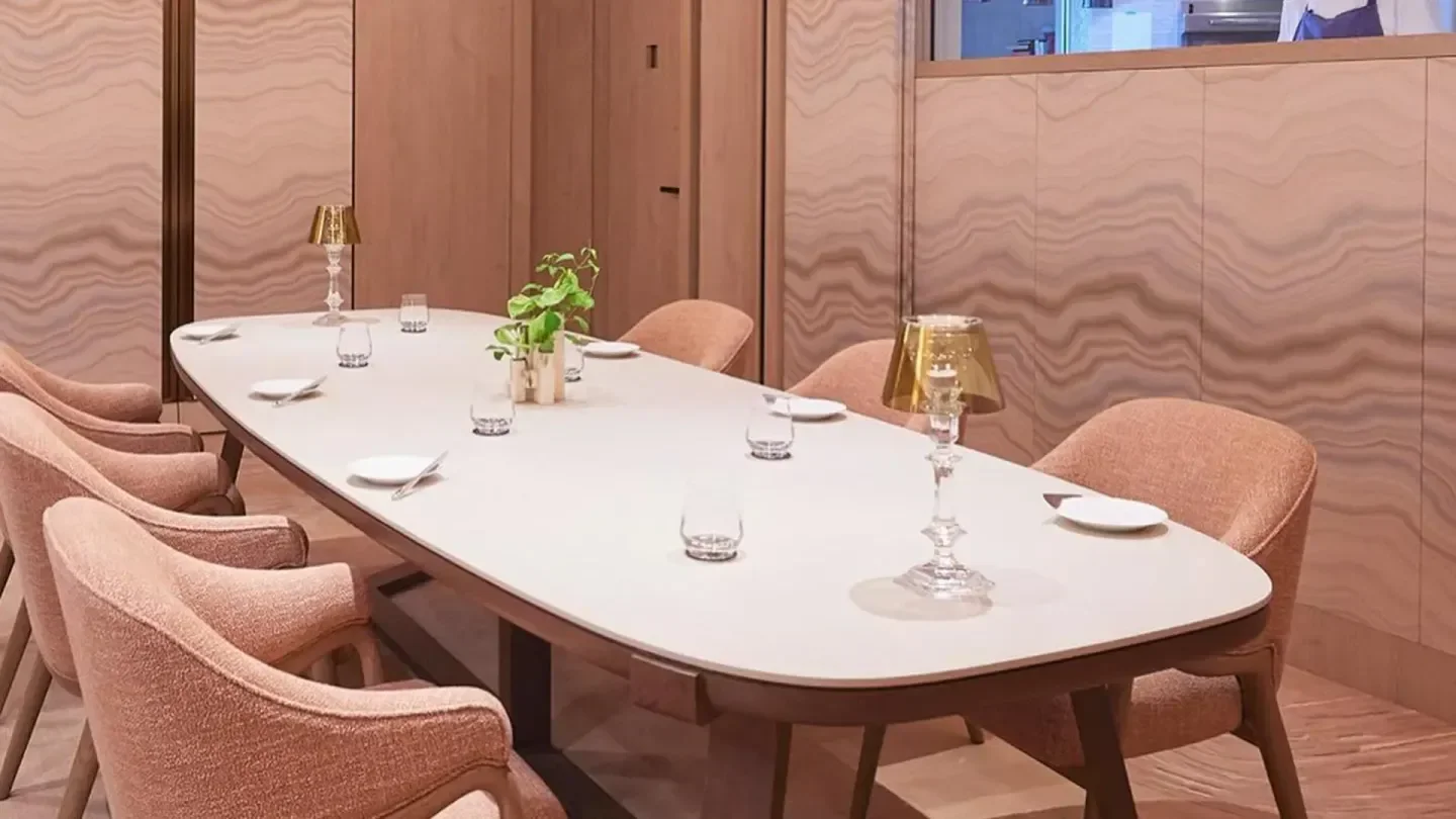 Elegant dining space at SÉZANNE restaurant in Tokyo, featuring a long table setting.