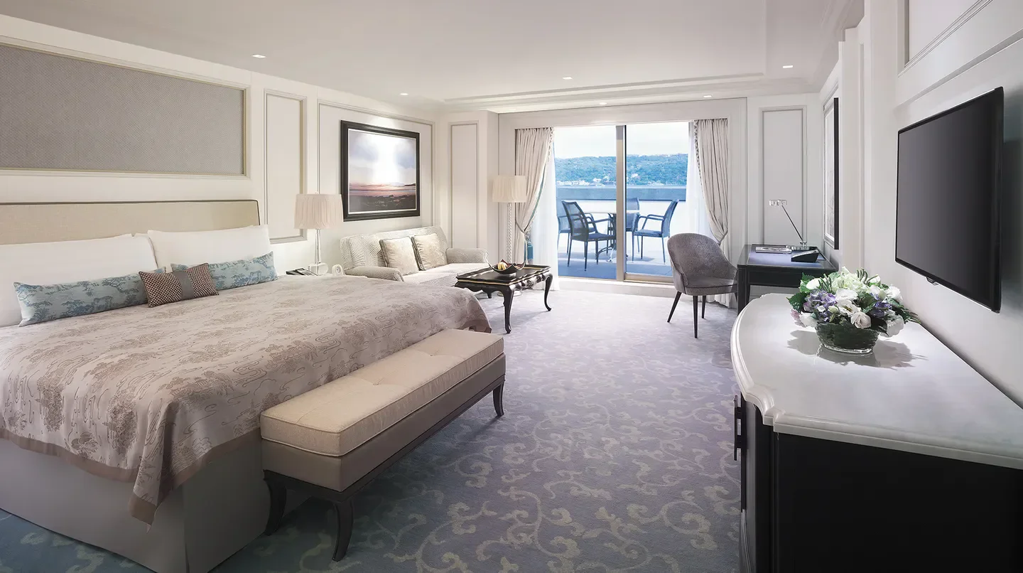 Elegant bedroom at Shangri-La Bosphorus, Istanbul, with balcony overlooking the city.