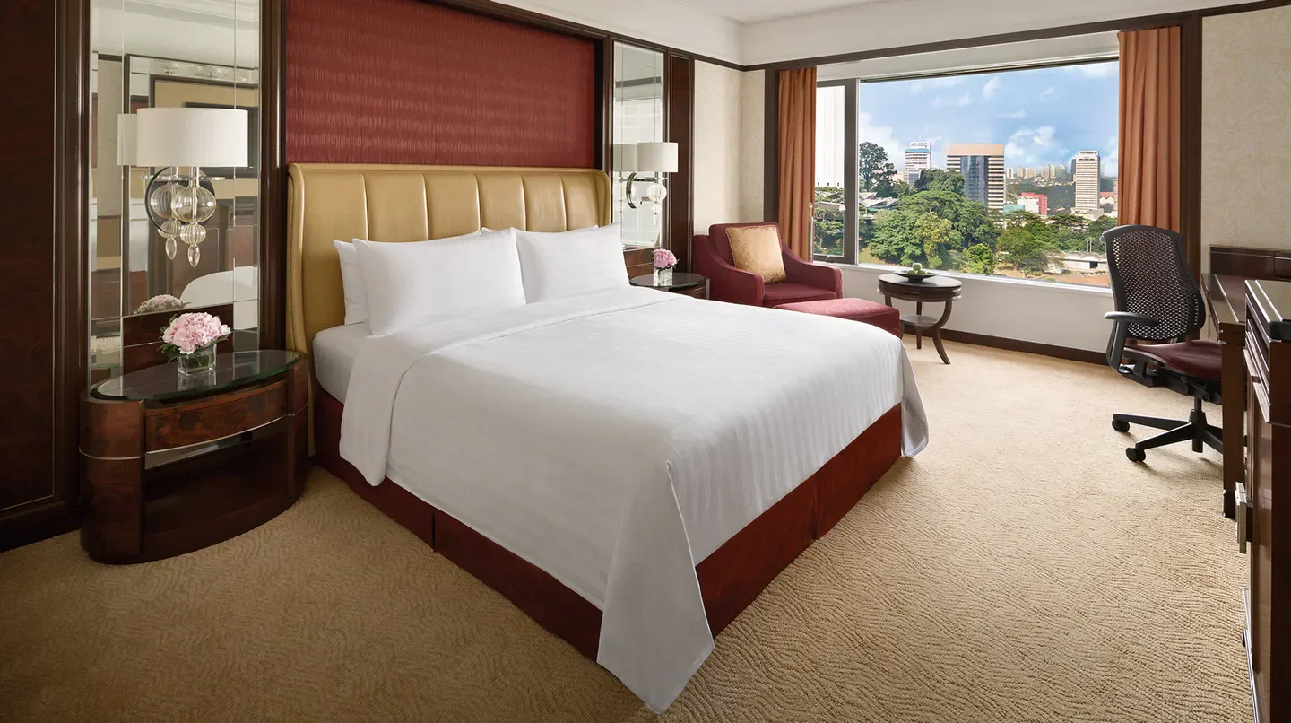 Spacious bedroom at Shangri-La Hotel, Kuala Lumpur with city views in Kuala Lumpur.