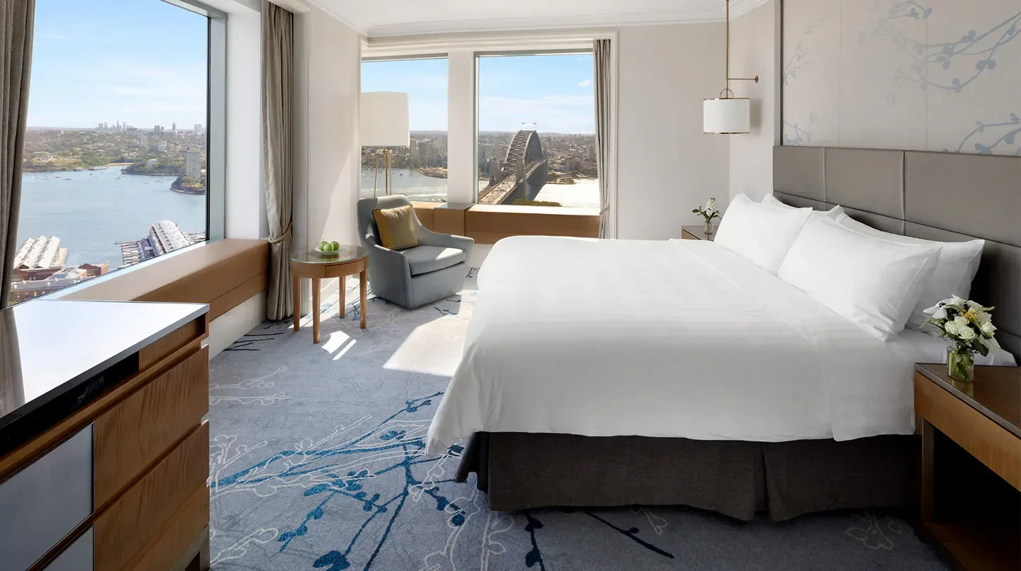 Luxury room with harbor views at the Shangri-La Hotel, Sydney, featuring Sydney Harbour Bridge.