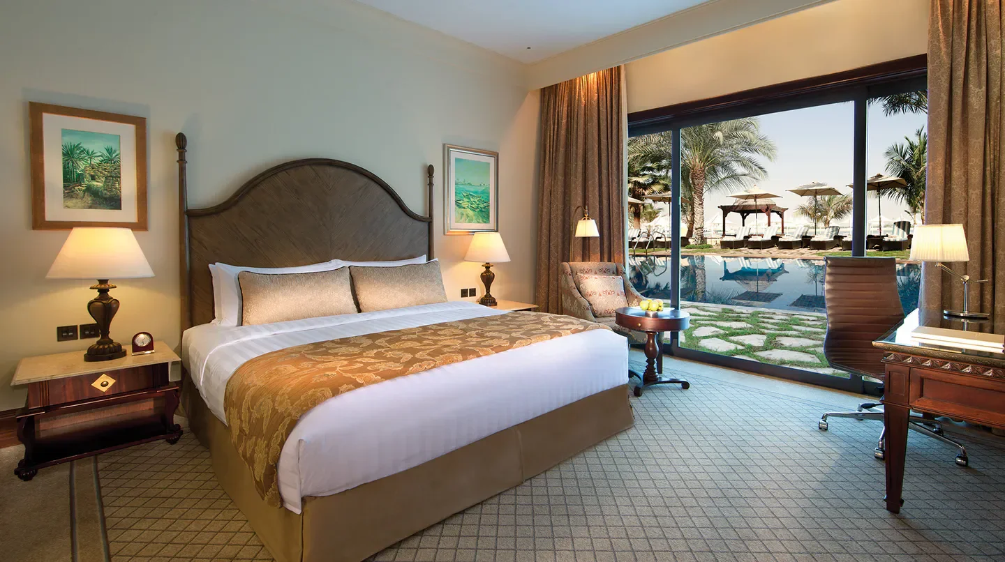 Bedroom view at Shangri-La, Qaryat Al Beri, Abu Dhabi, with pool and Abu Dhabi views.