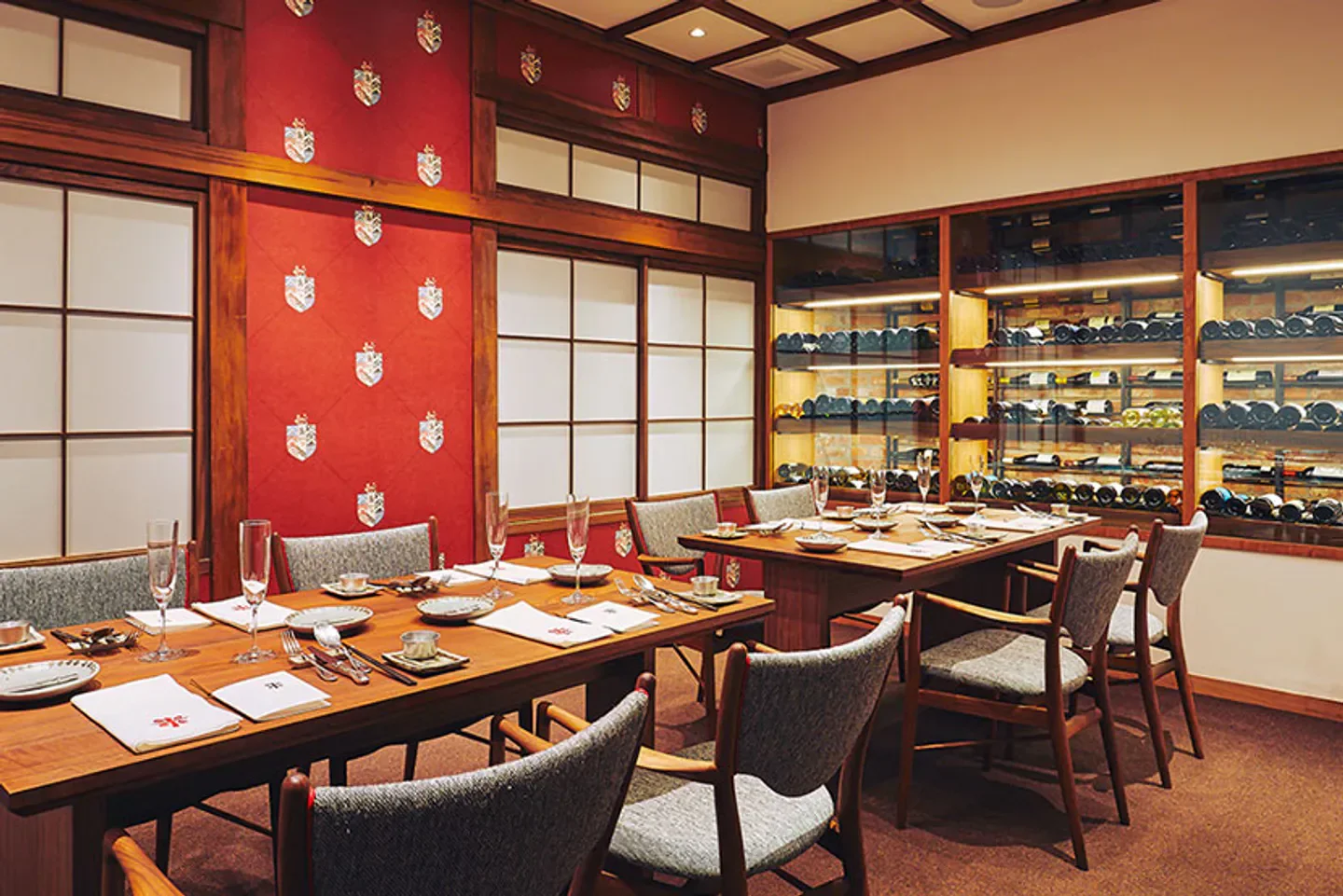 Dining area at Shimmonzen Yonemura Restaurant in Kyoto, showcasing elegant decor and wine selection.