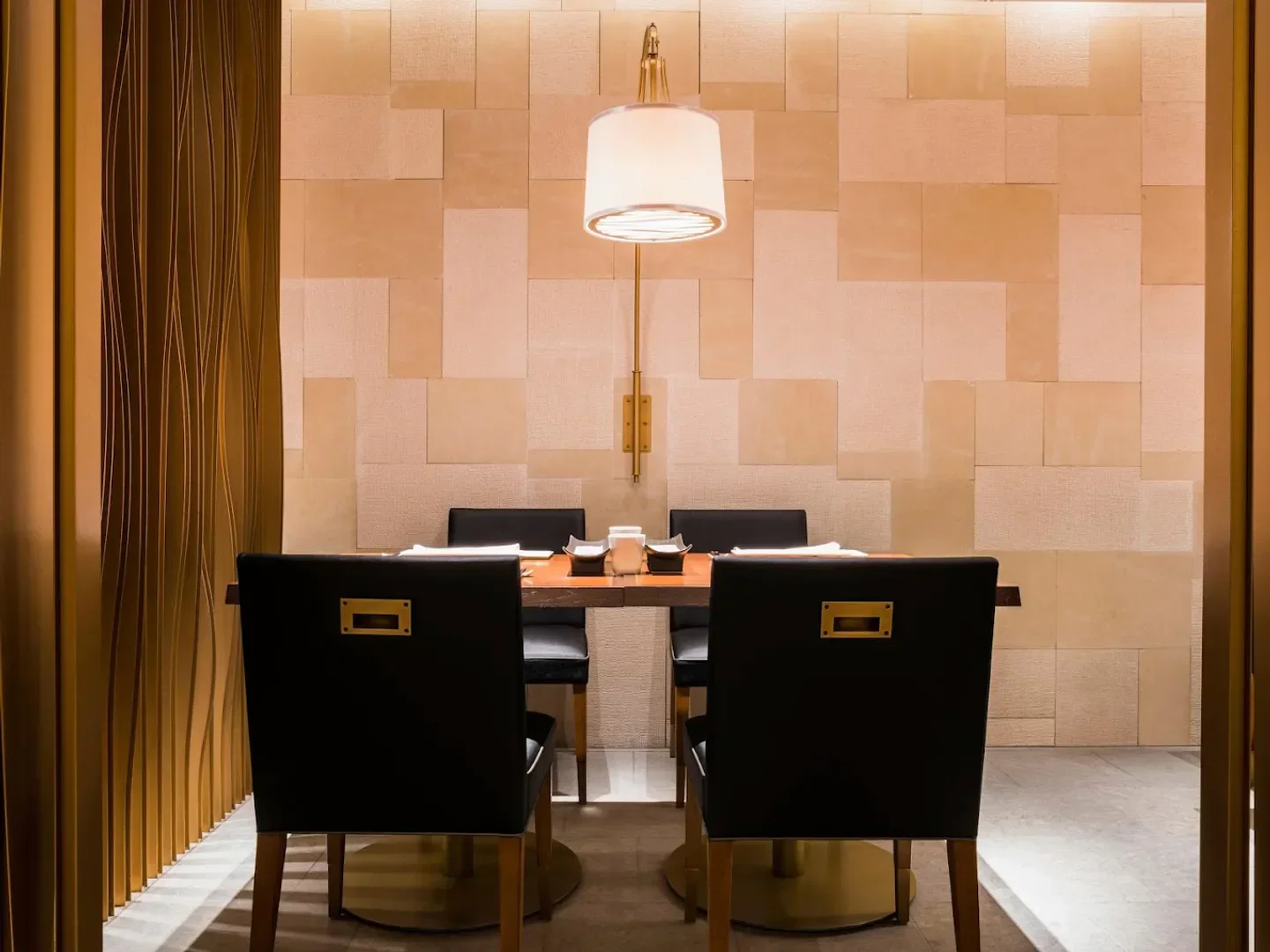 Elegant dining area at SH'UN Wine & Dine, a restaurant in Osaka with stylish decor.